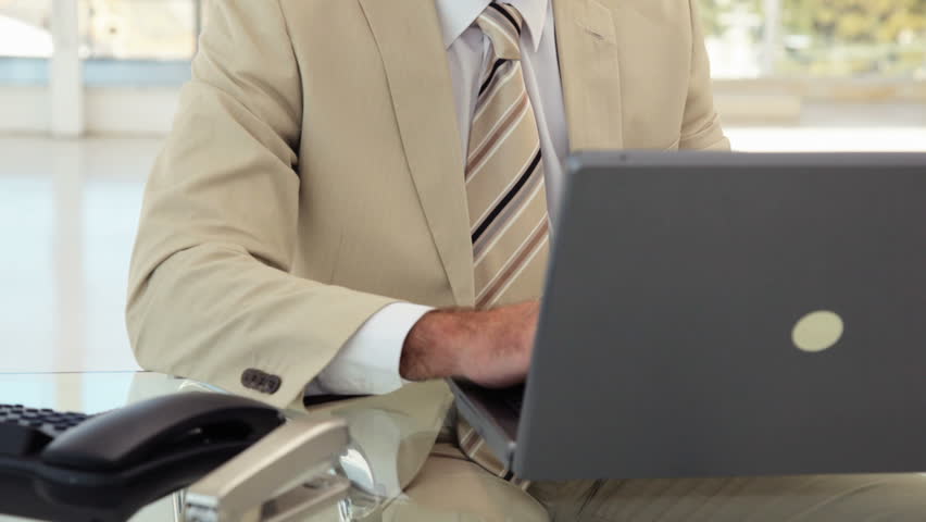 Mature Businessman Answers the Phone