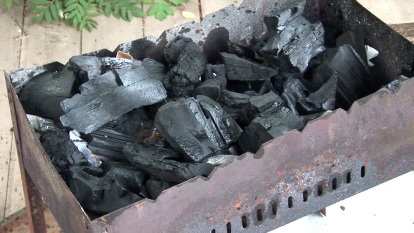 lighting BBQ coals with match