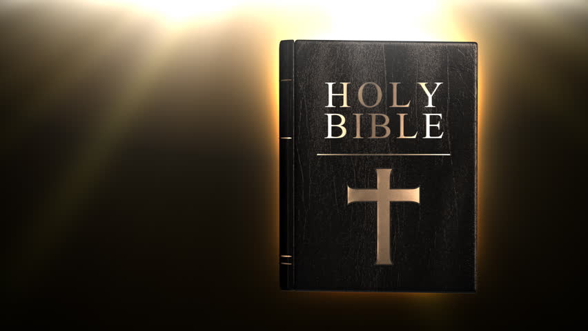 Holy bible with glowing rays in background