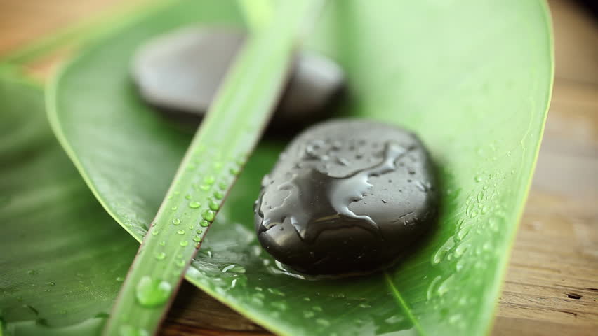 water-drops splash on spa stones