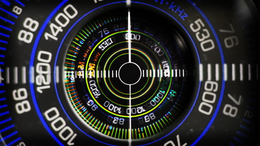 Close-up of the circular radio dial of an old retro radio