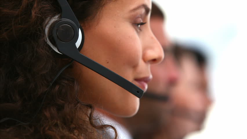Friendly woman smiling on a customer support team in an office