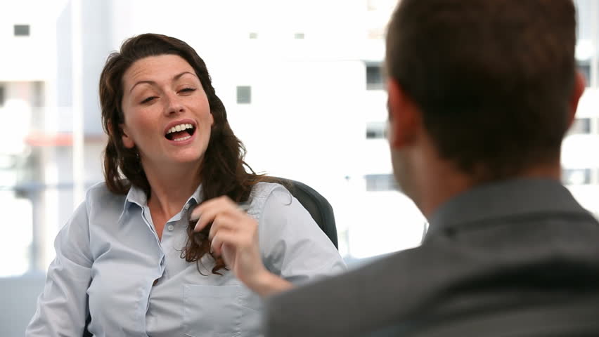 Appointment between a businesswoman and a businessman in the office
