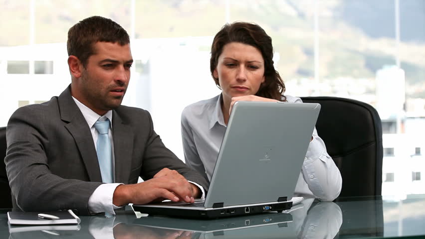 Businesswoman and a businessman working together in a office