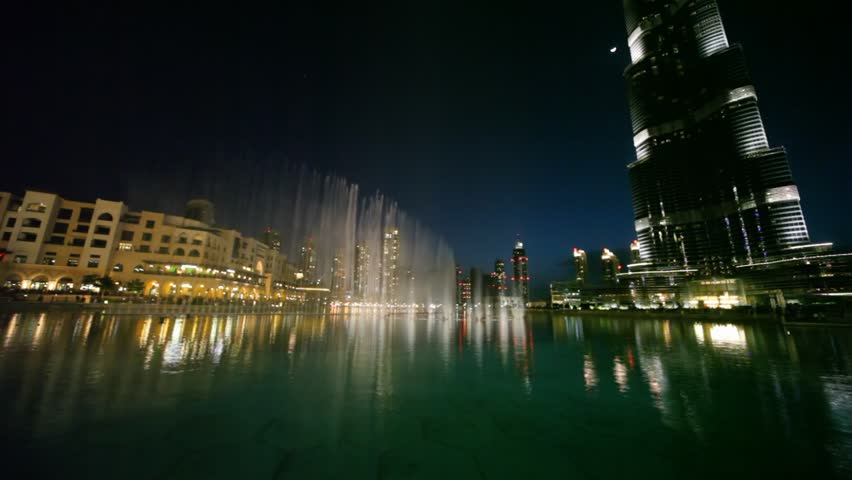 DUBAI - APRIL 17: Fountain near Burj Khalifa illuminated by the city at night, April 17, 2010 in Dubai, UAE. Burj Khalifa is the tallest man-made structure in the world. 