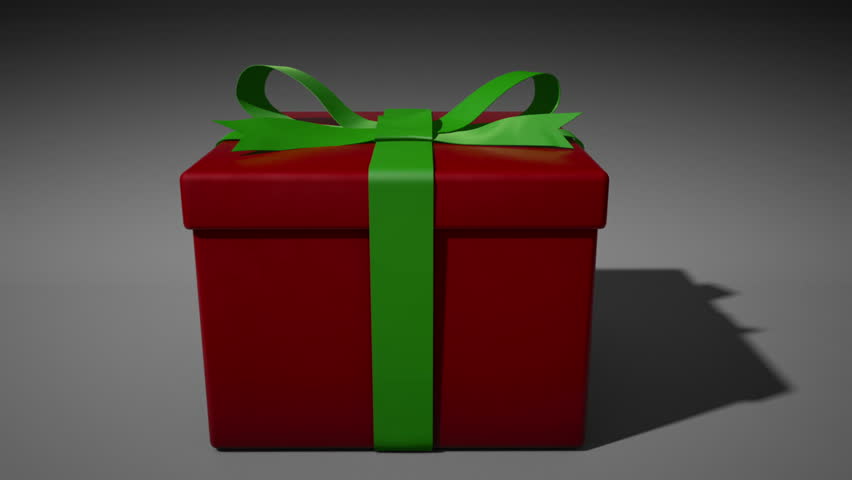 A 1080p HD Stock Video of Christmas a Present unwrapping itself and opening with volume light shooting out as the camera comes in to the box full of white light.