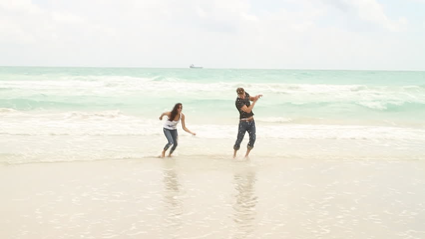 Slow Motion - couple on beach flirting