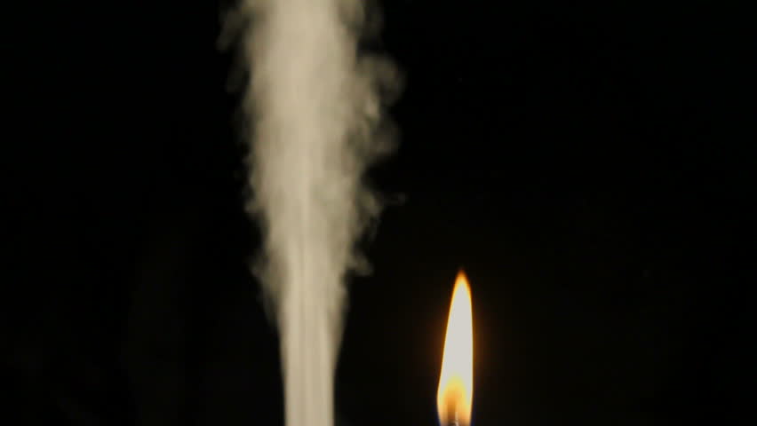 Plume of smoke spews next to burning flame. 1080p