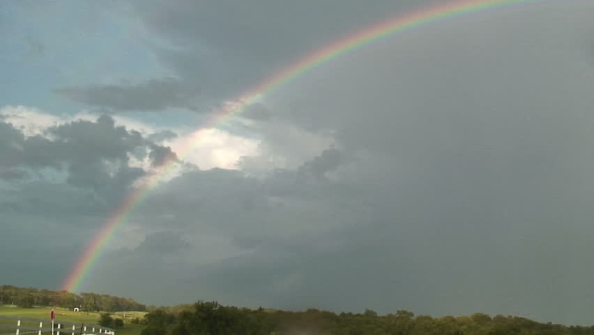 A rainbow across some farm land