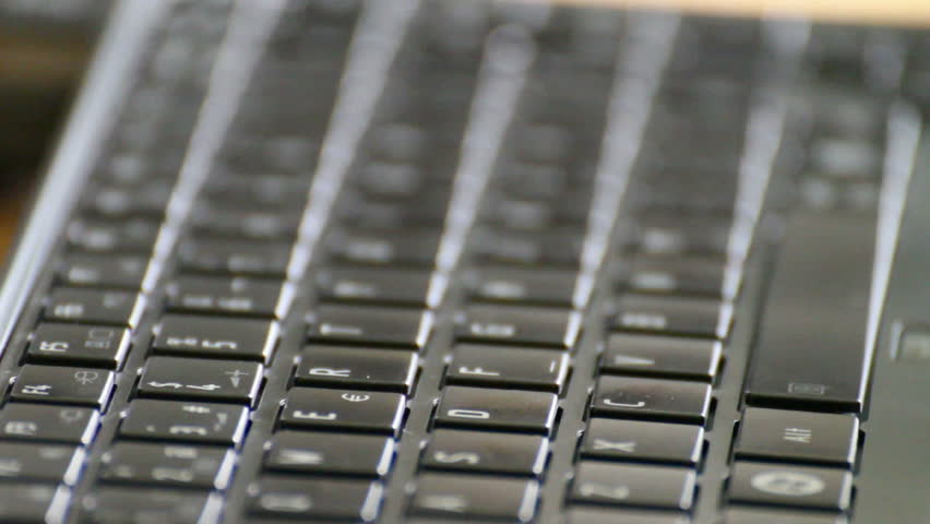 Closeup of caucasian man typing on laptop