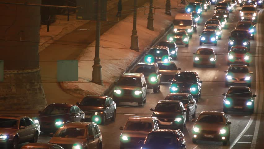 cars in hard traffic jam on street of Moscow at night