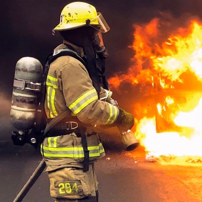 Firefighter Wearing Protection Gear Stock Photo (Edit Now) 1022571658