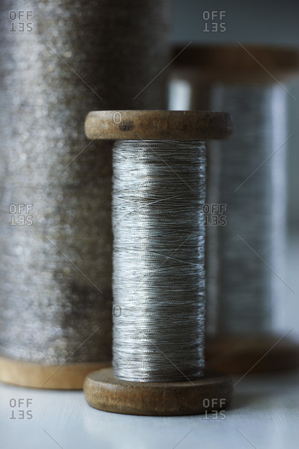 Three vintage spools of silver thread