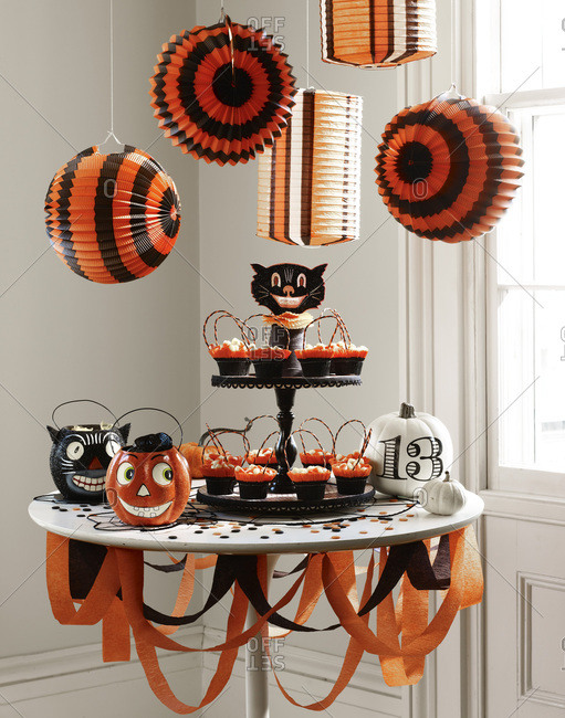 Halloween decoration and cupcakes on a table