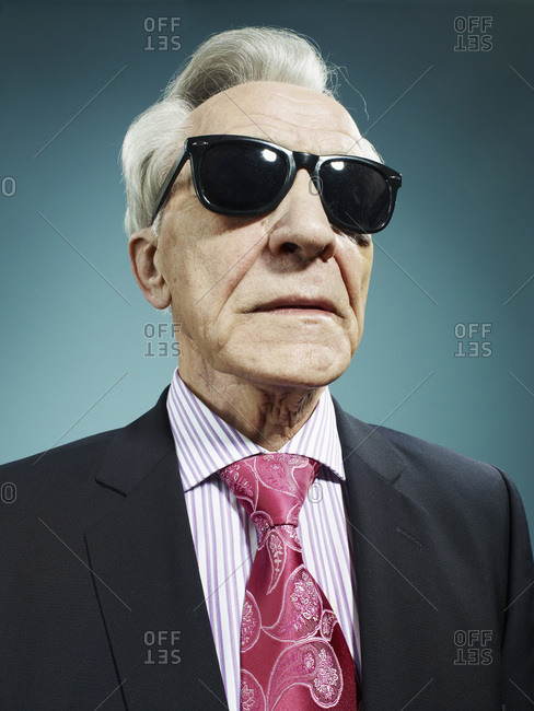 An elegant senior man wearing sunglasses