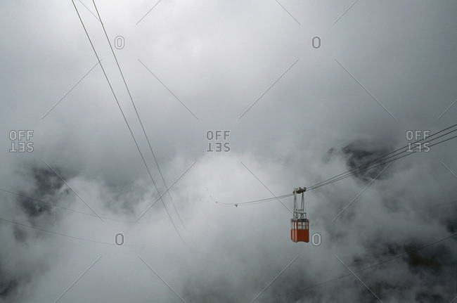 Overhead cable car traveling into mist, M��rida, Venezuela
