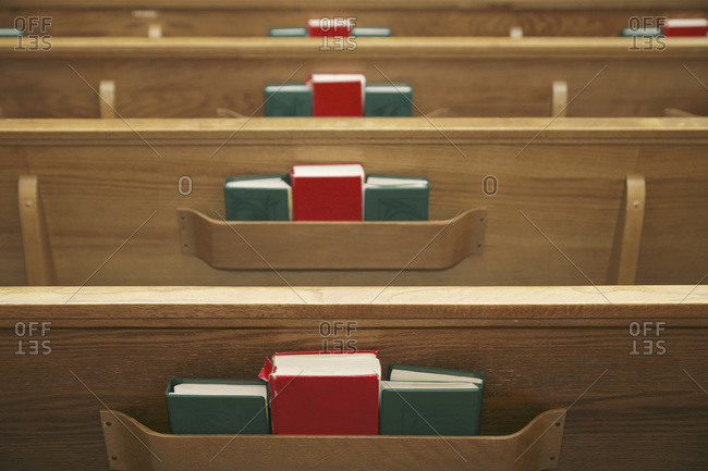 Empty church pews and hymnals