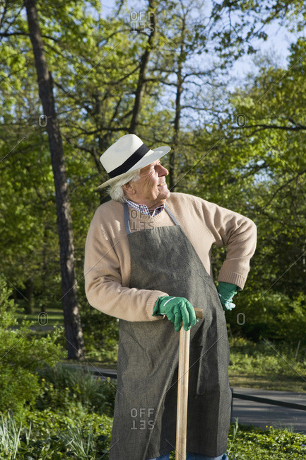A senior man resting while doing gardening