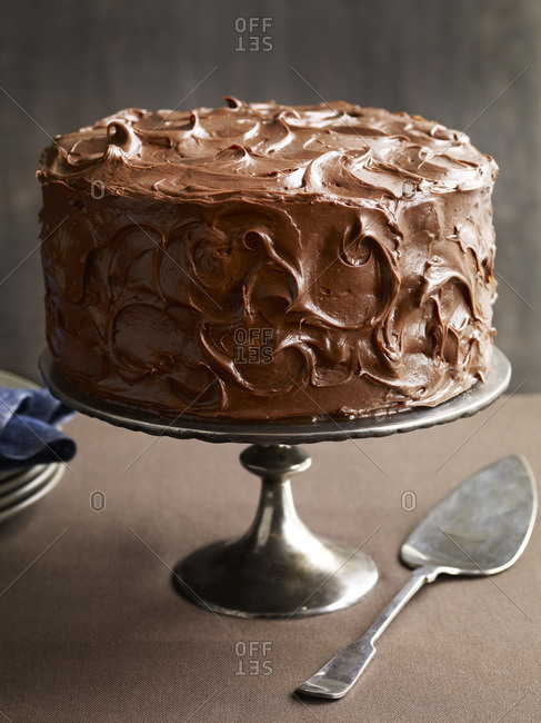 Tempting whole chocolate cake with chocolate icing.