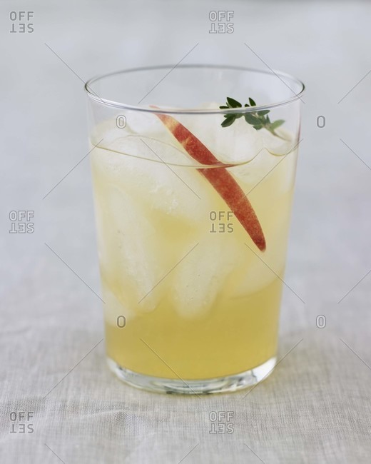 An apple cocktail with ice cubes