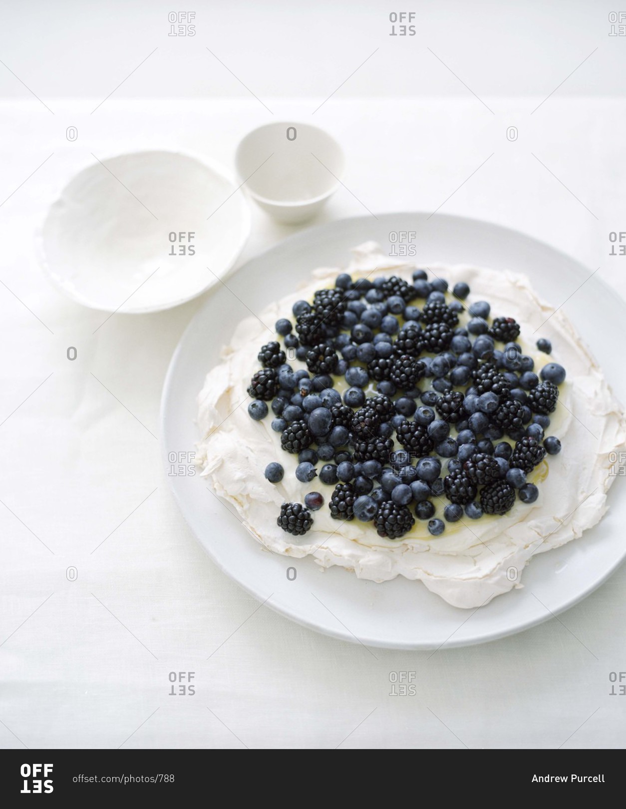 Berry pavlova cake with berry topping