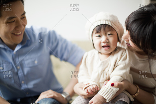 Young parents with baby girl (12-17 months)