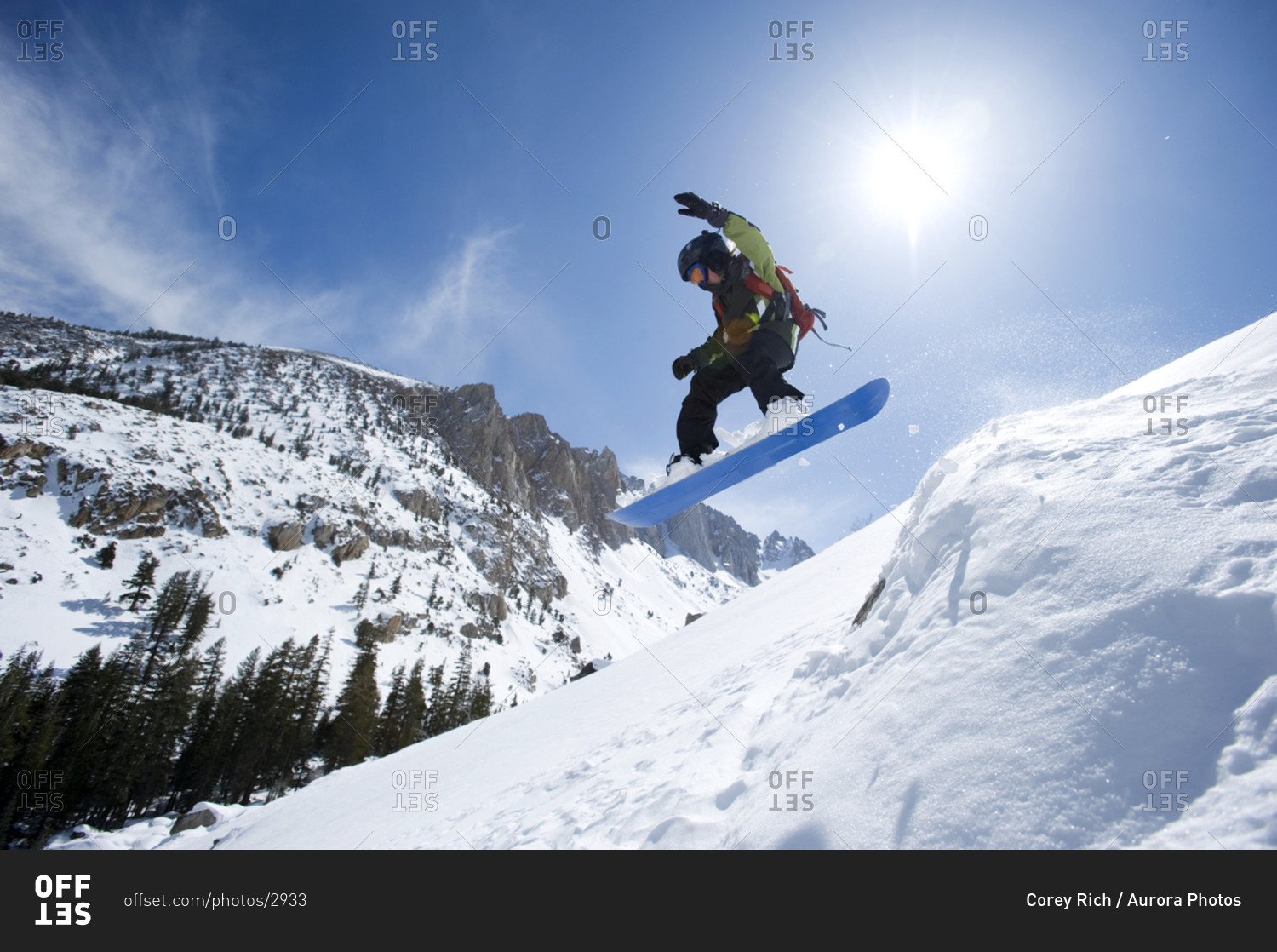 A boy snowboarding in the California backcountry