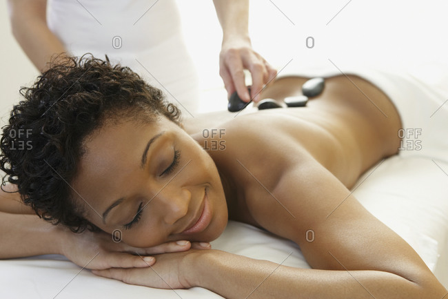 Closeup of young woman receiving neckline and chest massage by female  massage therapist in a spa Stock Photo - Alamy