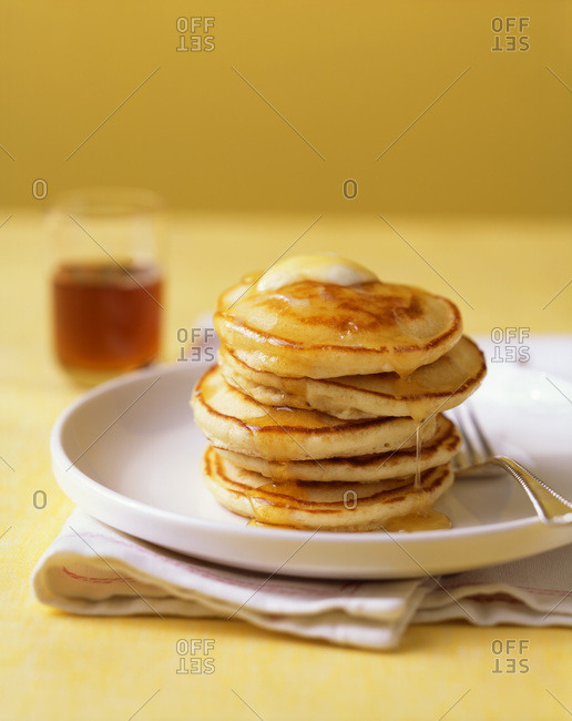 Close up of fresh american pancakes with maple syrup