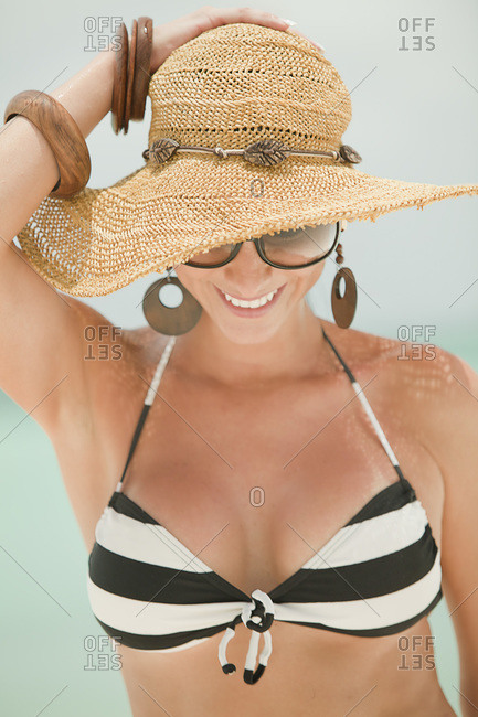 Smiling Woman in Bikini and Floppy Hat on Beach, Aruba