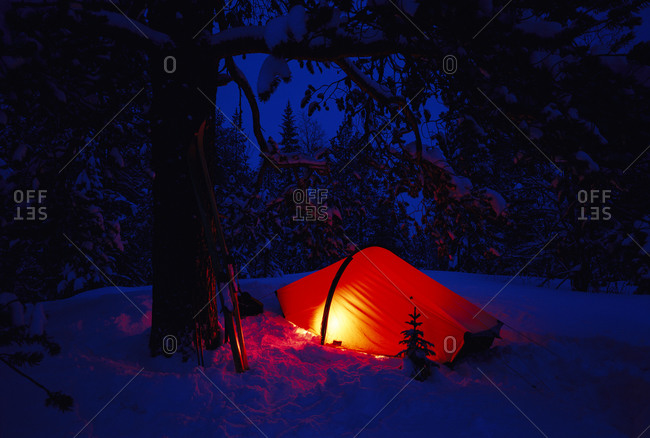A red tent in darkness