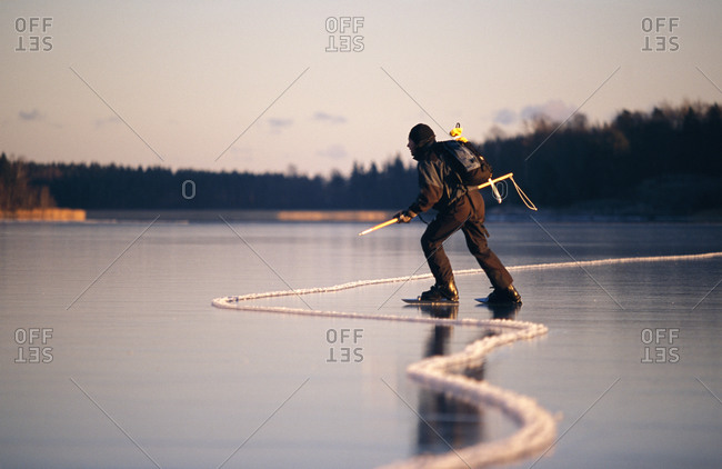 A long-distance skater by a crack in the ice