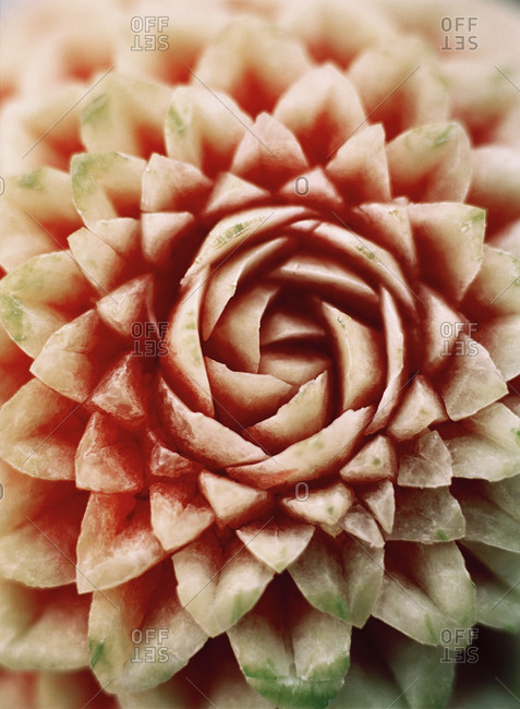 A melon cut in patterns