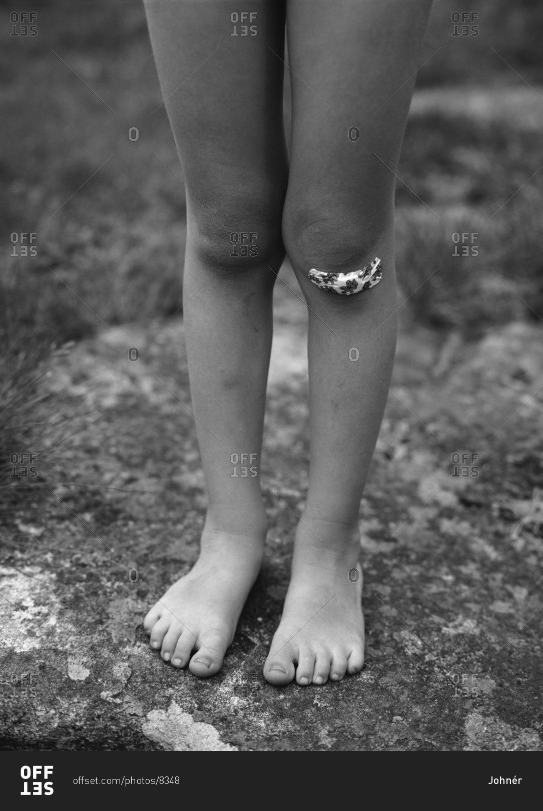 A child with a plaster on the knee, Sweden stock photo - OFF