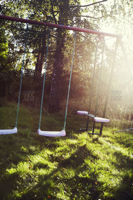 Empty swing in playground - Offset