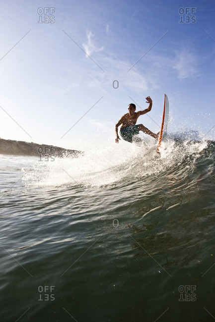 Man surfing in southern California. San Diego, California surfing.