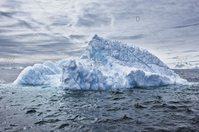 Iceberg floating in ocean water in Antarctica