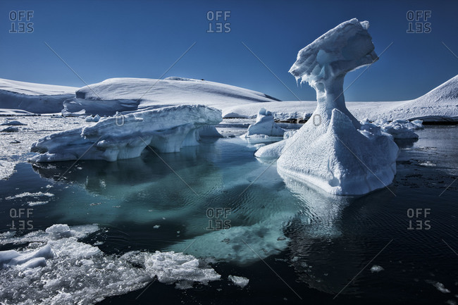 Iceberg formations floating offshore of the ice sheet of Antarctica