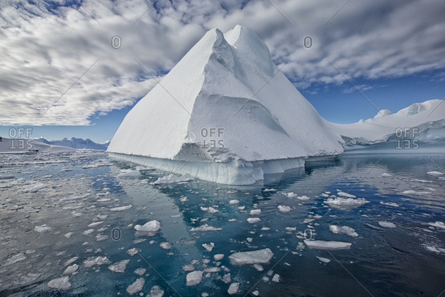 Massive iceberg floating in ocean water in Antarctica