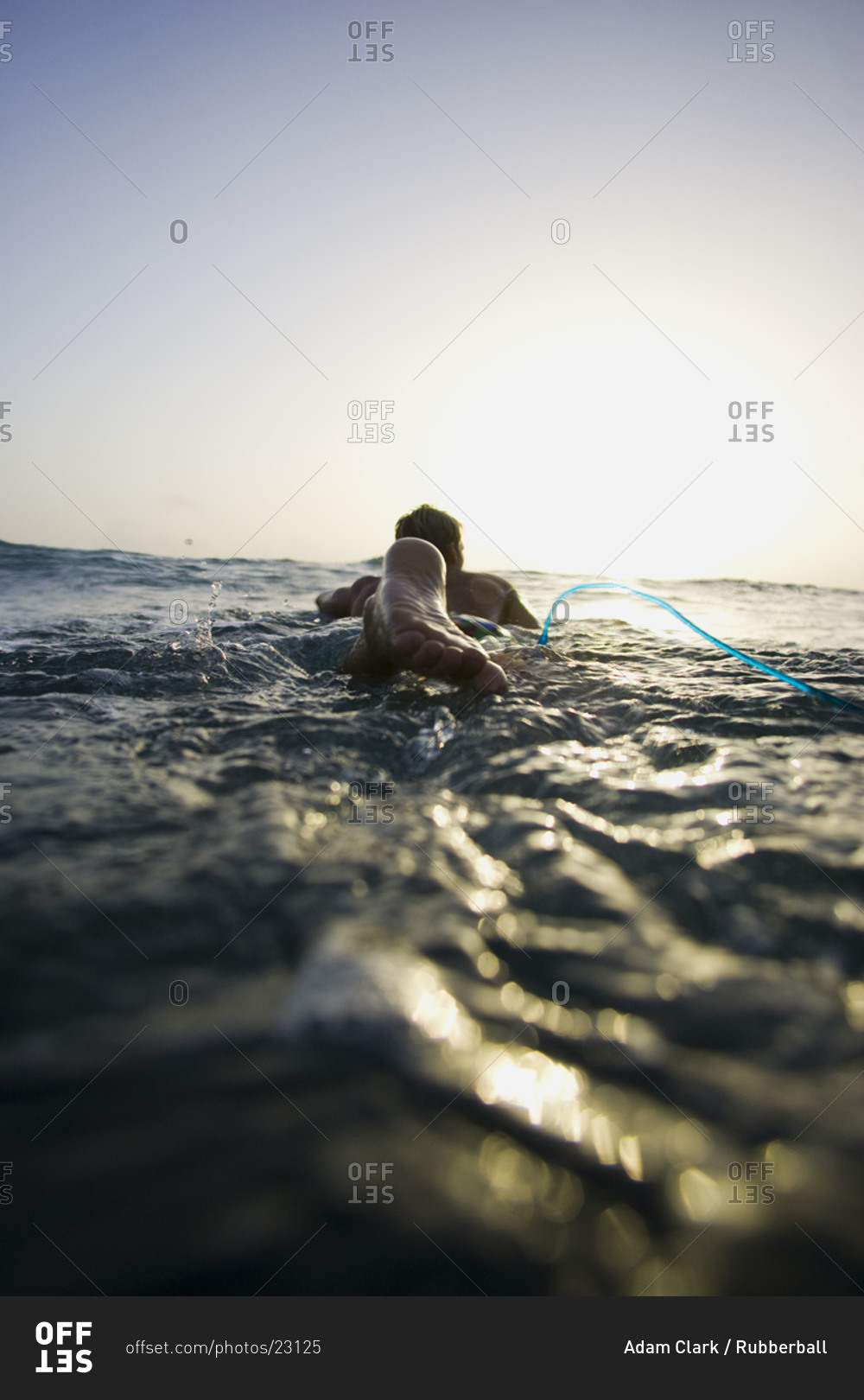 Rear view of man in water with rope
