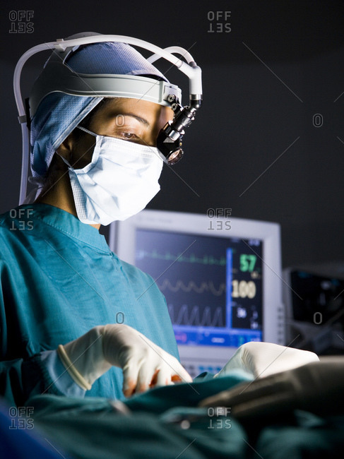 Female surgeon during surgery - Offset