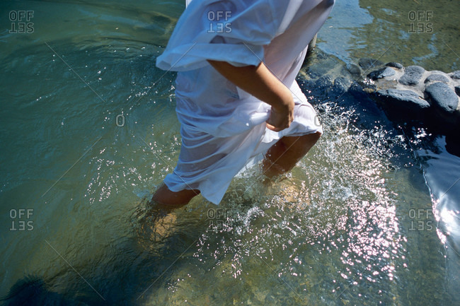 Jordan River, Israel-A close view of feet in river water after baptism