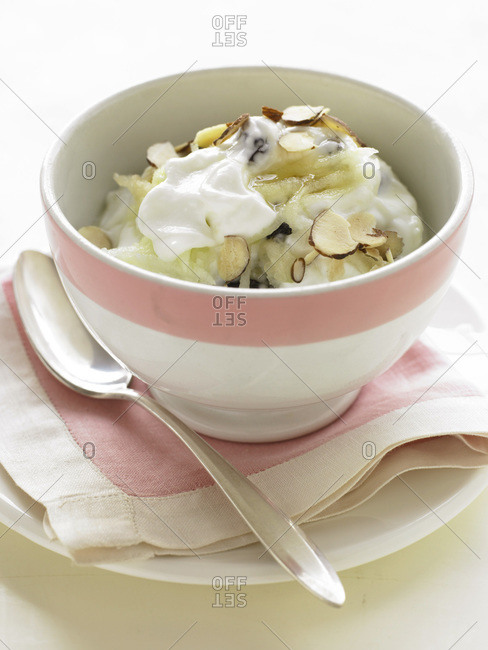 Yogurt with fruit and almonds in a bowl