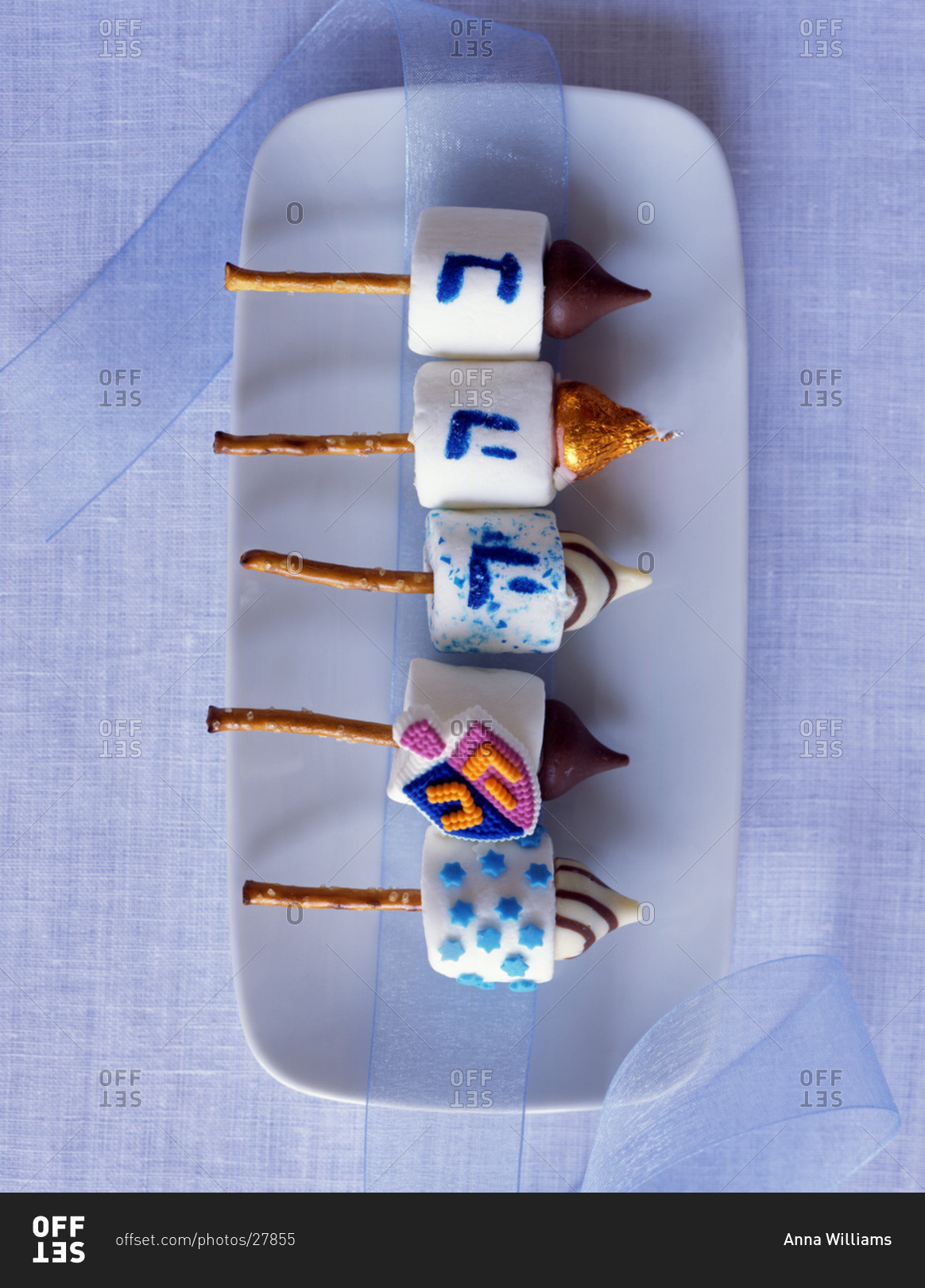 Traditional Jewish dreidels made of marshmallows and pretzels and