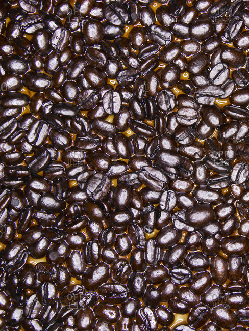 coffee beans with coffee spill or pool