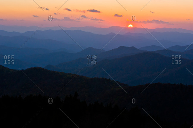 Sunset over layers of blue mountain ridges, Blue Ridge Parkway, North Carolina, Cowee Mountains Overlook