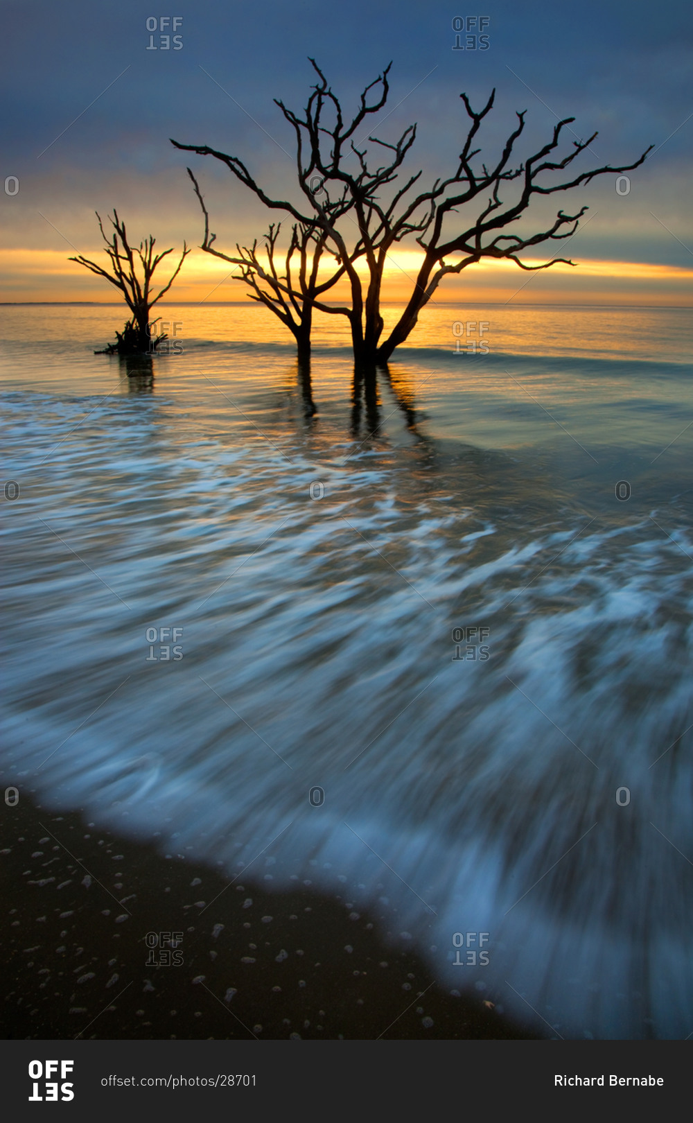 Sunrise over a calm Atlantic Ocean at Botany Bay Wildlife Management Area, Edisto Island, South