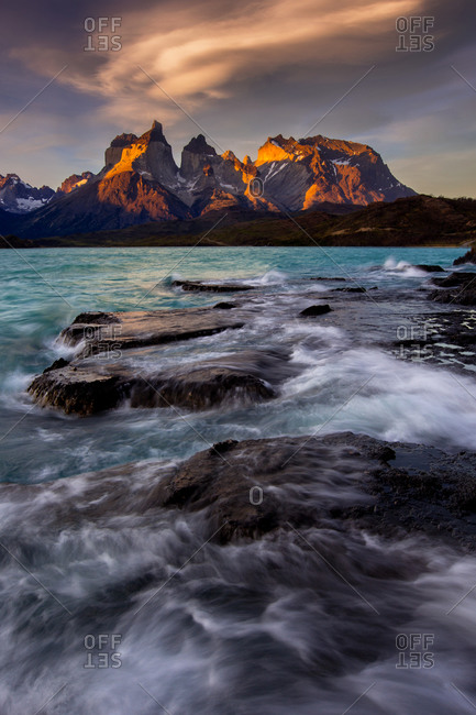 Sunset over Torres del Paine National Park with raging waves on Lago Pehoe in Patagonian Chile