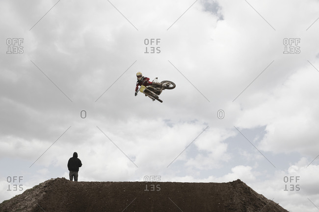 Low-angle view of a motocross rider jumping