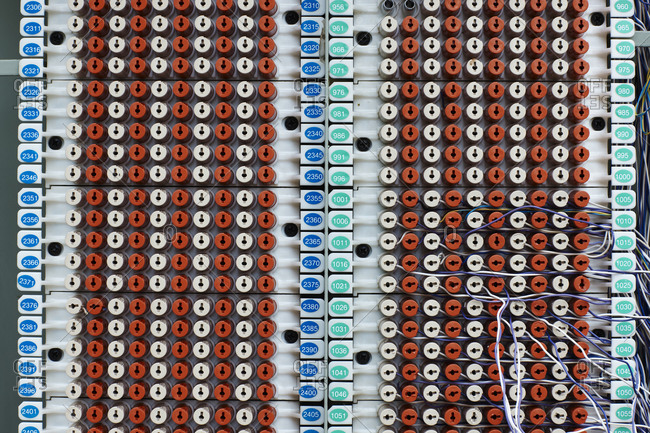 Many red and white switches and wire board